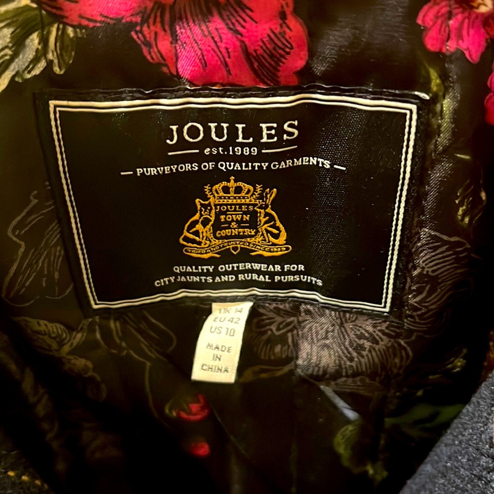 Navy jacket with yellow and red stripes, floral print inside